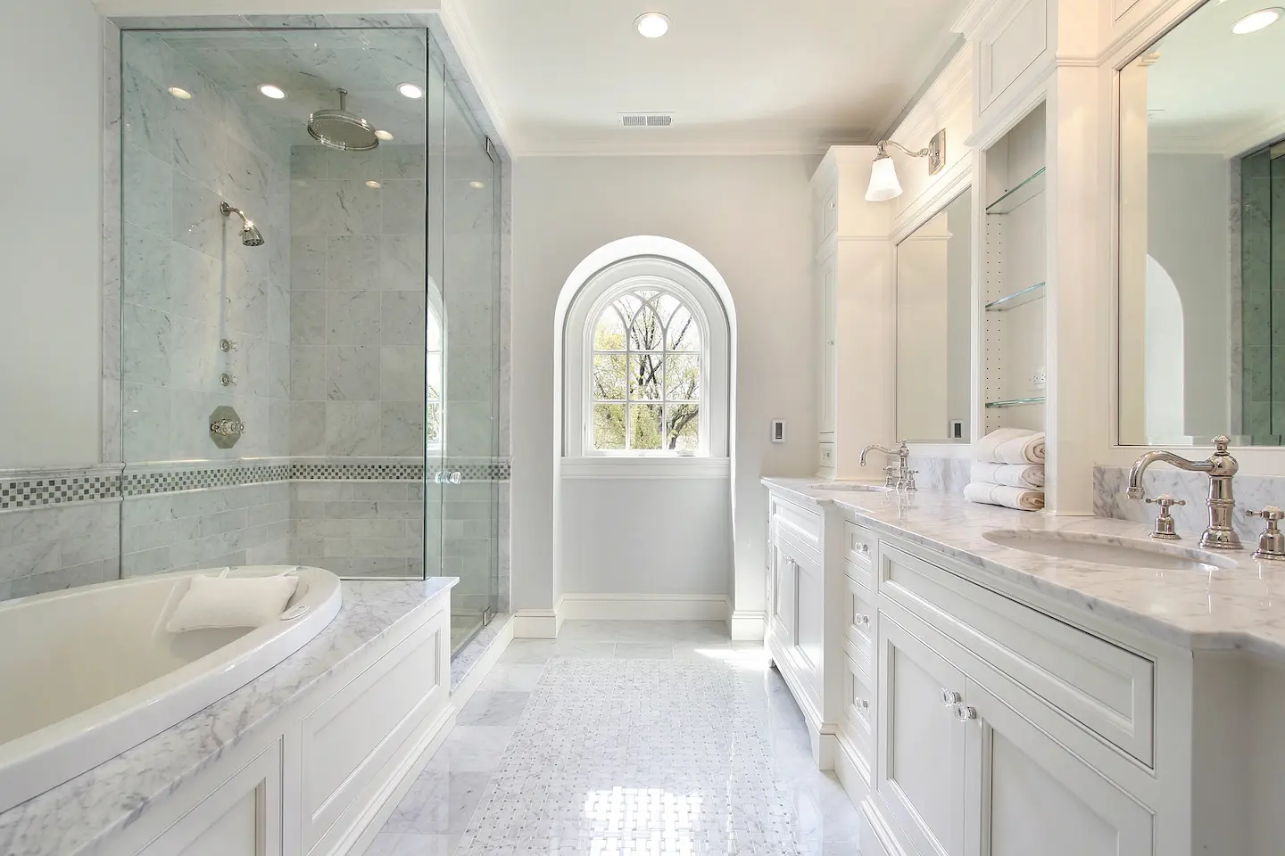 Depositphotos_8702649_XL (1) A Luxury Shower and Tub that is tiled in white.